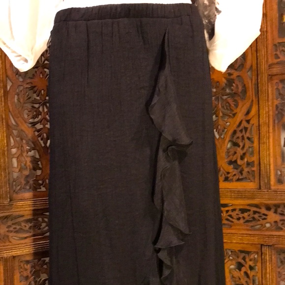 Black Skirt with High-Low Hemline and front slit with cascading ruffles. - Picture 4 of 14